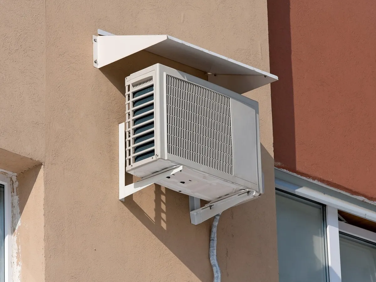 Brackets attached to the wall together with the outdoor unit